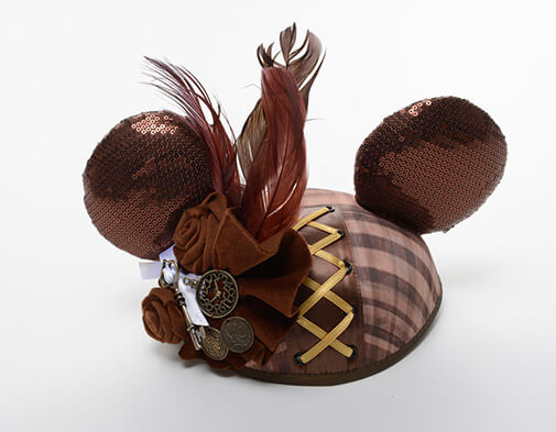 ear hat with brown sequins, gold lacing, feathers, and cloth roses