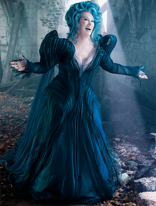 Meryl Streep with blue hair and stunning dark blue flowy dress