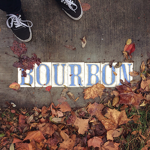 tiled “Bourbon” on the sidewalk
