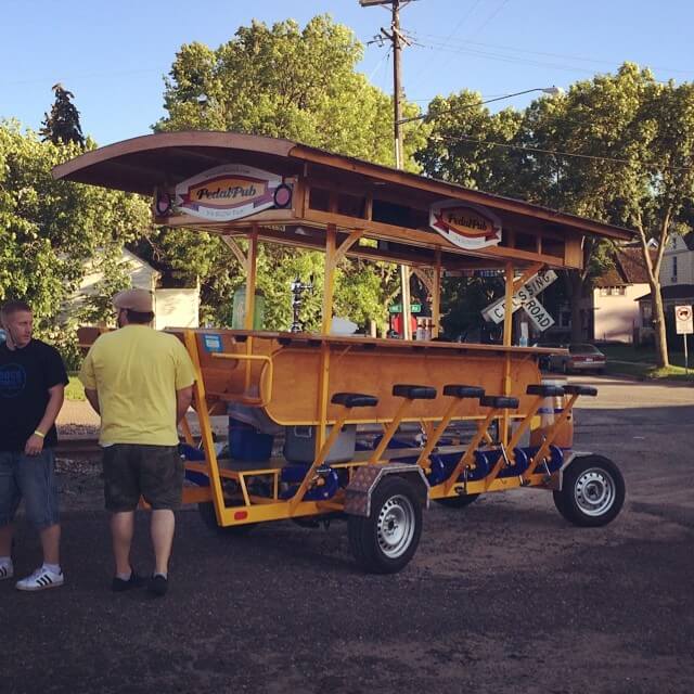 bar on wheels with seats and pedals