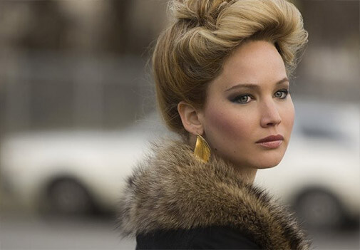 Jennifer Lawrence in fur coat and gold earrings