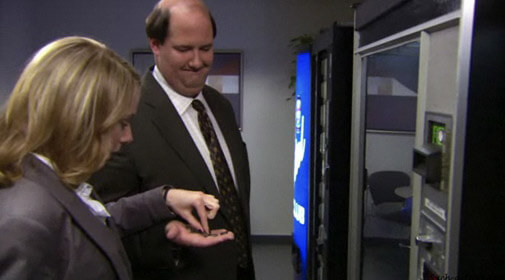 Holly counts coins in Kevin’s hand