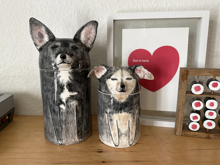 two ceramic urns that look like our two pups