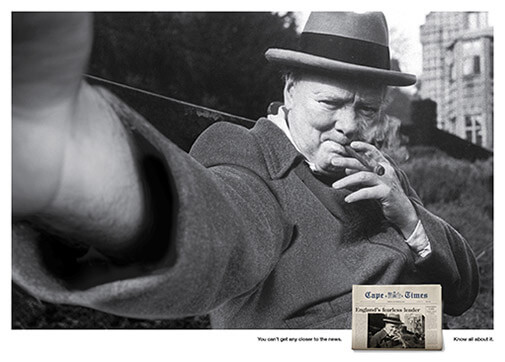 Churchill taking a selfie of himself smoking a cigar