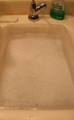tub of soapy water in the sink