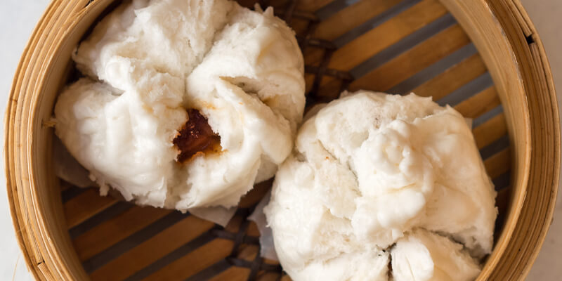 white fluffy buns filled with bbq pork