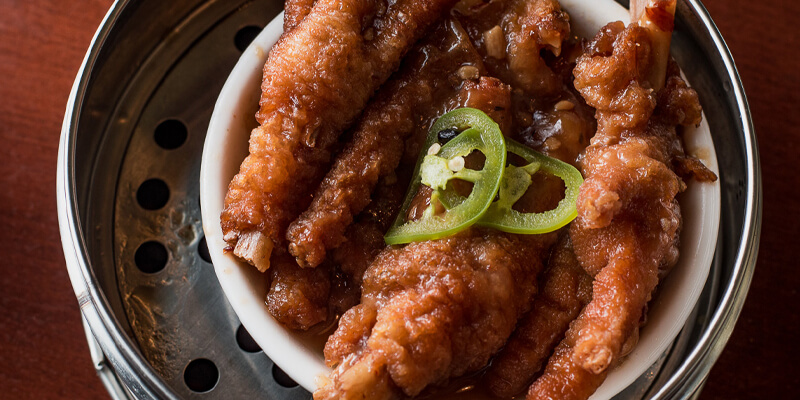 steamed chicken feet in black bean sauce with jalepeños