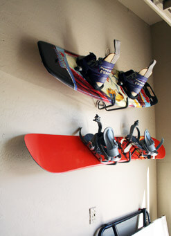 snowboard and wakeboard mounted on the wall