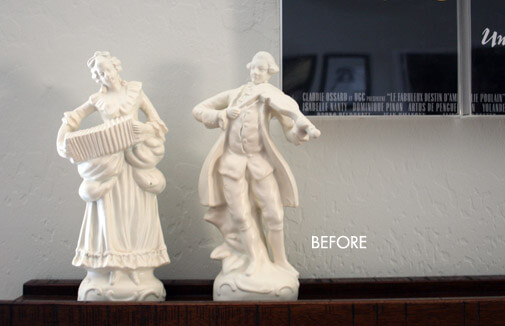 two white figurines of a Victorian man and woman playing instruments
