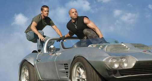 Paul Walker and Vin Diesel on the top of a car
