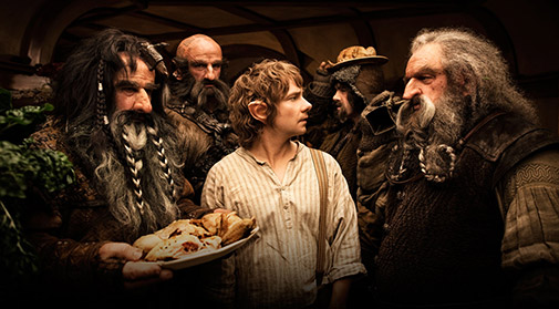 Bilbo with the dwarves in his house