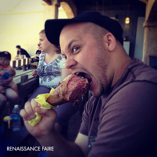 Jake eating a big turke leg at the Renaissance Faire