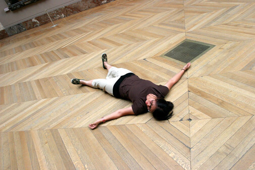 me lying on the floor of the Louvre Grande Gallery