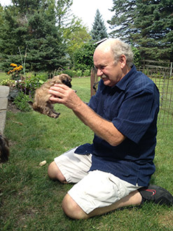 Clay’s dad with a tiny puppy