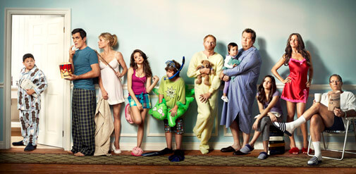 the cast of Modern Family all standing in line for the bathroom