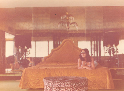 vintage photo of my mom lounging on a hotel bed