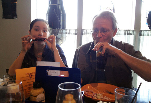Vanessa and dad eating wings