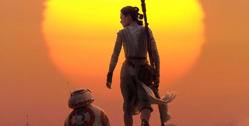 Rey and BB-8 in front of the sun setting