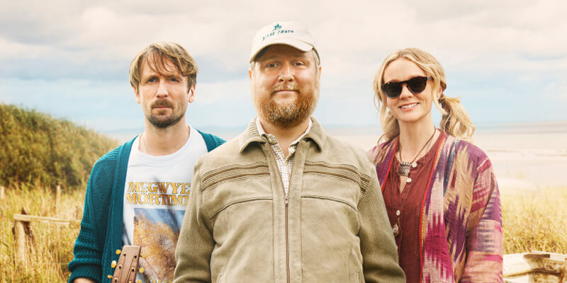 Tim Key, Tom Basden, and Carey Mulligan with the sea behind