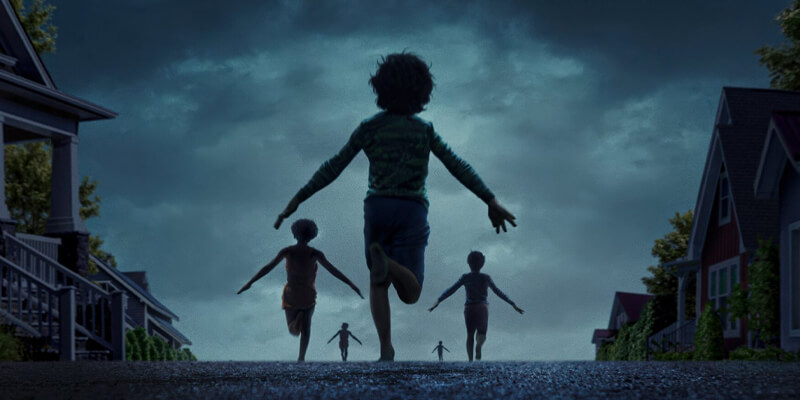 dark neighborhood street with children running, their arms spread wide at their sides
