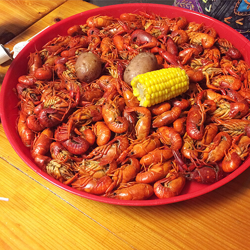 big plate of crawfish, corn, and potatoes