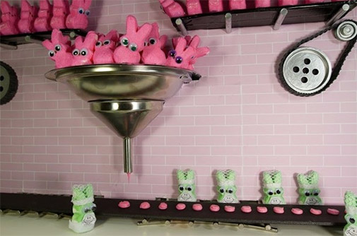 pink peeps going into a big funnel and plopping out as little burgers on an assembly line