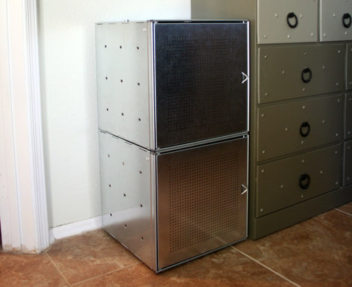 two stacked metal storage cubes with doors
