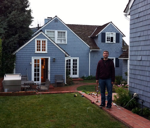 Clay playing croquet in the backyard of our rental