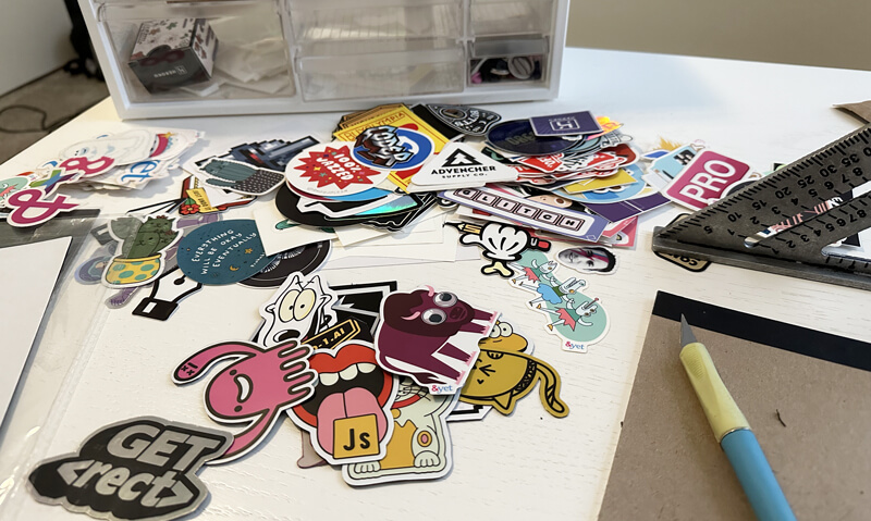 a big pile of stickers on a desk