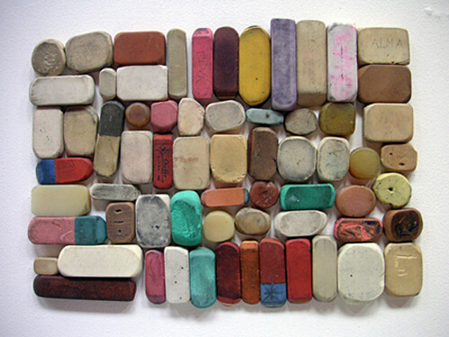 a bunch of rubber erasers organized neatly