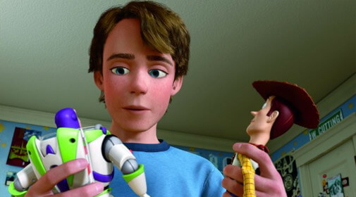 Andy looking at Woody and Buzz