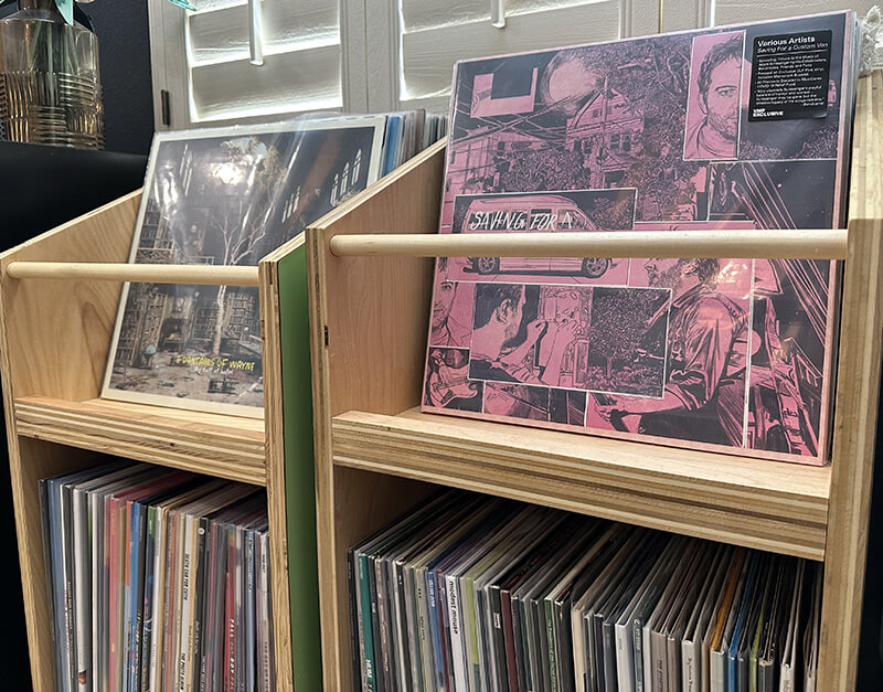 two small shelves of vinyl records