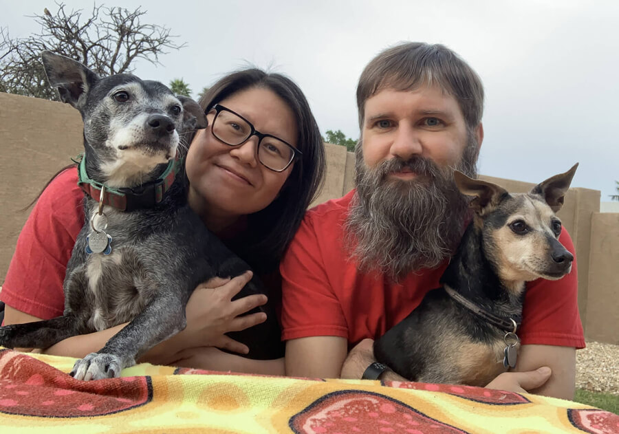 Lynn and Clay with Boomer and Helo in their backyard