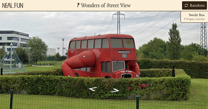 Swole Bus in Prague, Czechia: a red double decker bus with two buff arms coming out the side